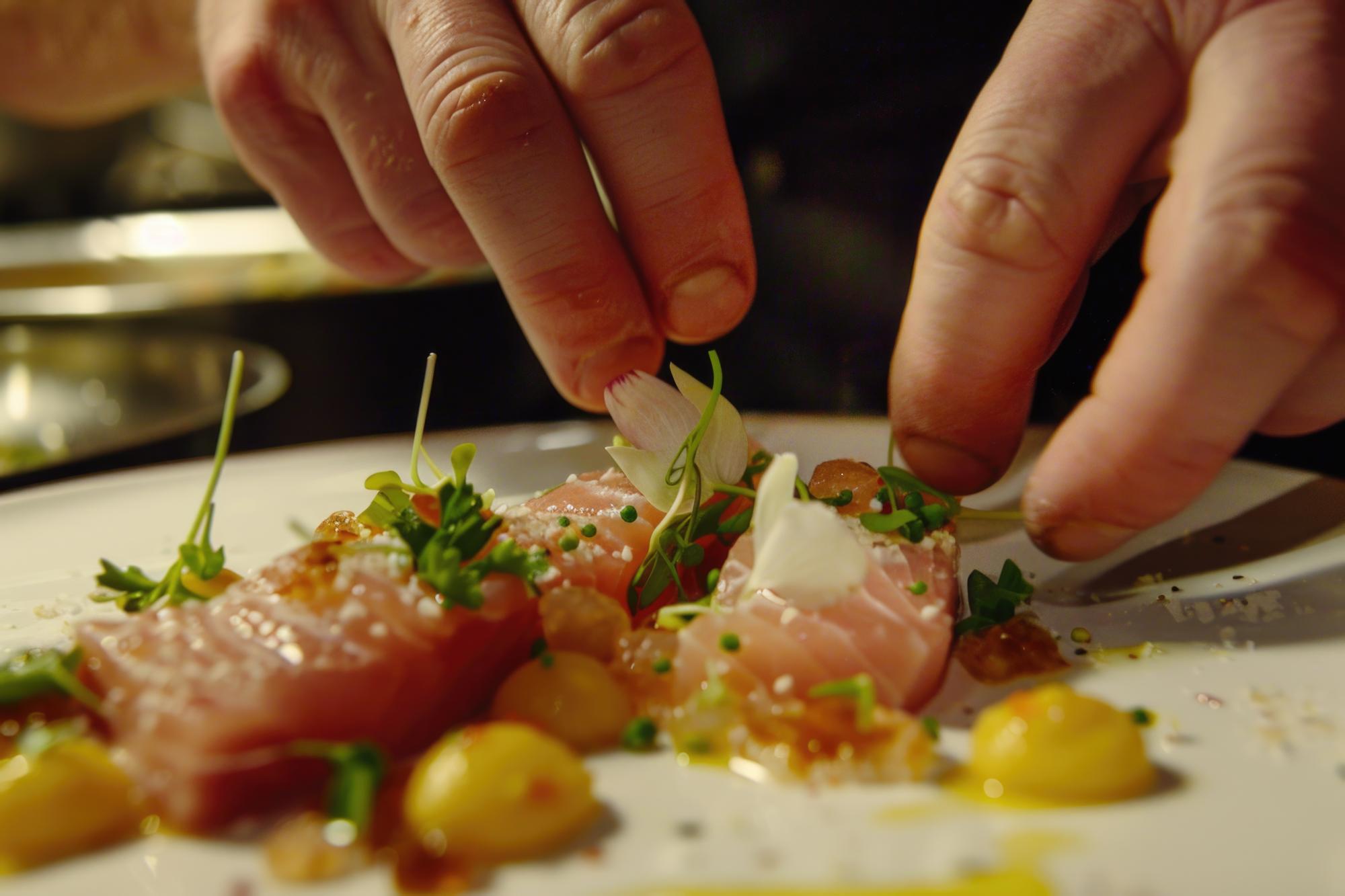 Assistant chef preparing garnish